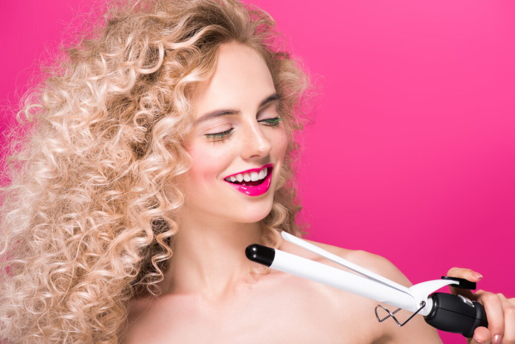 Discover the secrets to transitioning to naturally curly hair and enjoy the benefits of healthy hair and wellbeing. curly young womain